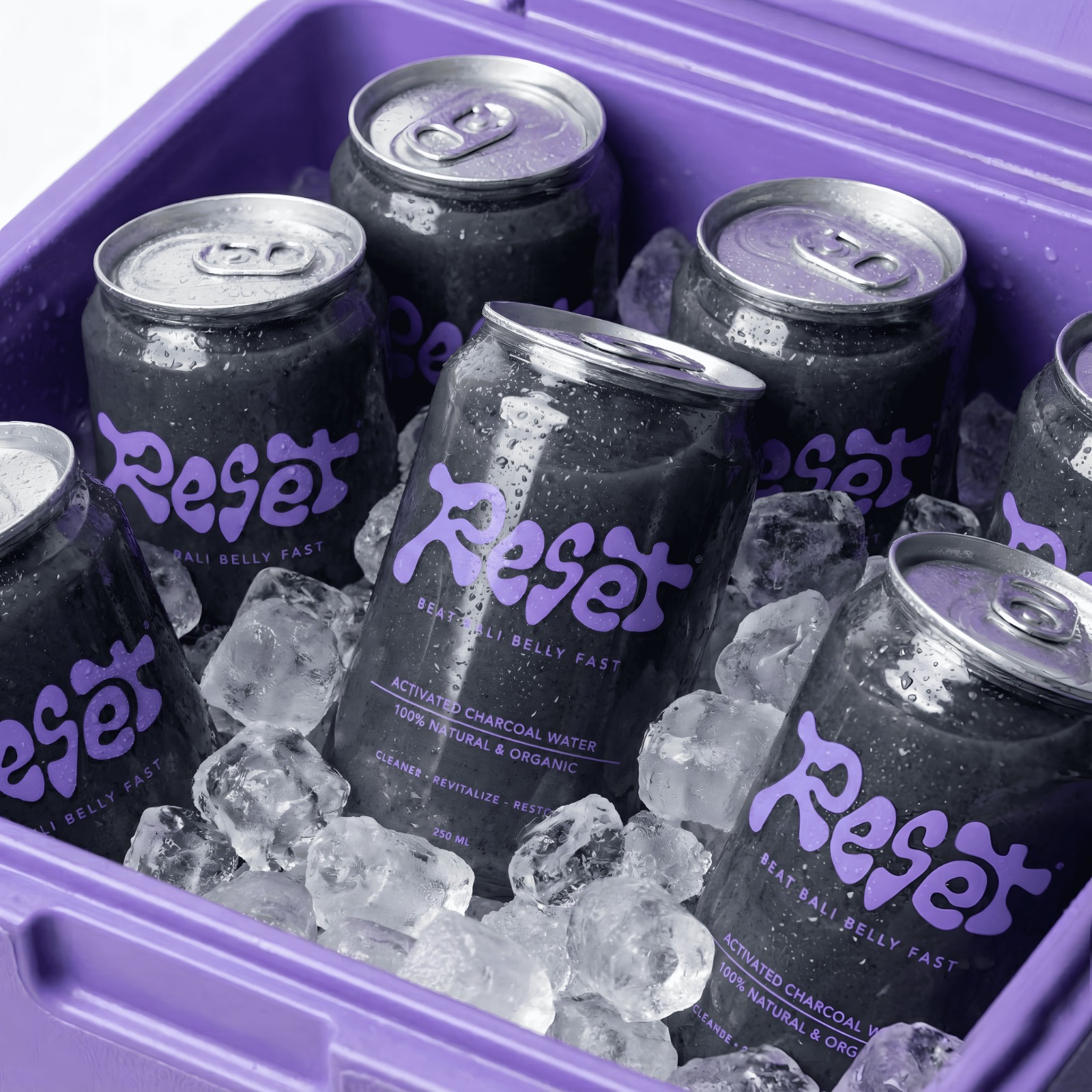 RESET cans chilled in a purple cooler